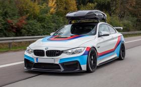 BMW M4 със 700 коня, 305-милиметрови полусликове отзад и 405-литрова карбонова кутия на покрива, която държи на 300 км/ч. Какво му трябва повече на човек?